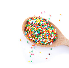 Fototapeta na wymiar Colorful sprinkles in spoon on white background. Confectionery decor