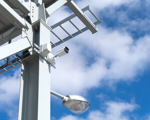 outdoor surveillance and security video camera installed on a metal structure