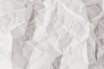 Crumpled white paper background.