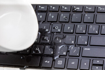 drops of water on a black keyboard