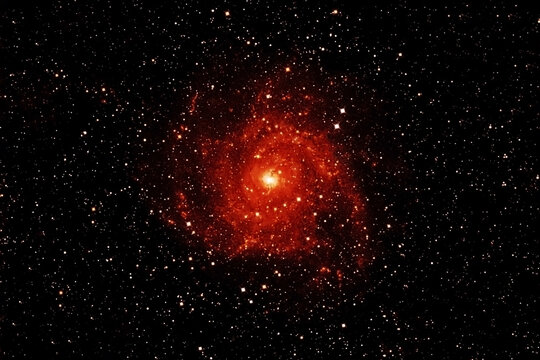 Galaxy in red colors. Elements of this image were furnished by NASA.
