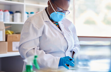 African female technician working with samples in a lab