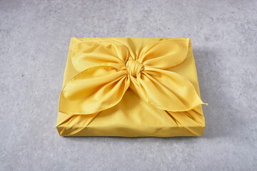 yellow gift box with bow