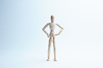 wooden mannequin in different poses on a white background