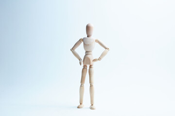 wooden mannequin in different poses on a white background