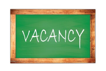 Fototapeta premium VACANCY text written on green school board.