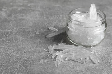 Menthol crystals on grey background. Space for text