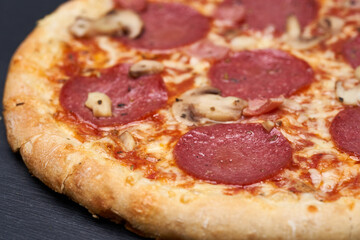 Delicious pizza on wooden board