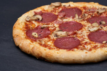 Delicious pizza on wooden board