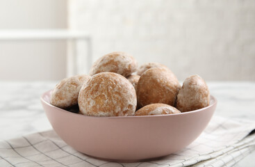 Tasty homemade gingerbread cookies in bowl on table