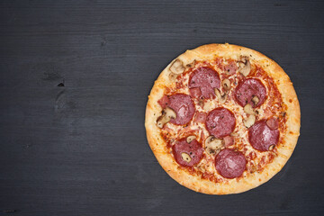 Delicious pizza on wooden board