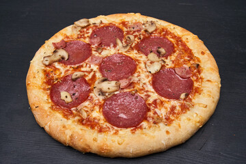 Delicious pizza on wooden board