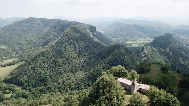 Aerial Backward: Church Building On Mountain During Sunny Day
