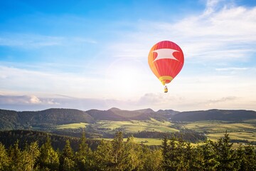 Fototapeta premium balloon amid blue sky . soar in the clouds