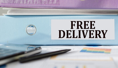 FREE DELIVERY text written on folder with documents and calculator.
