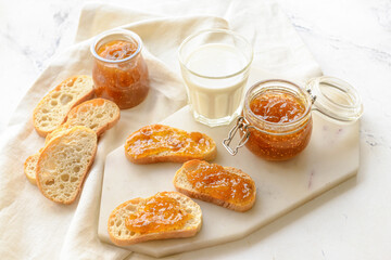 Composition with sweet fig jam on light background