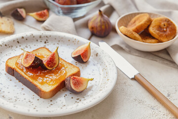 Toast with sweet fig jam on grunge background