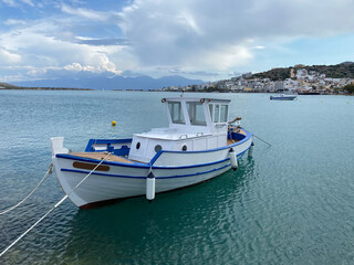 Fototapeta na wymiar View on Elounda harbour with white boat on Crete Island, Greece