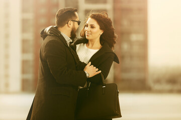 Happy young couple in love on city street