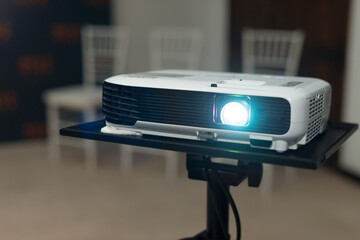 Photo of a working projector in an office or at home.
