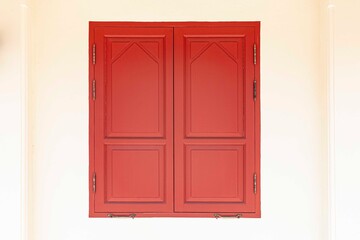 Old red wooden windows and light cream cement walls