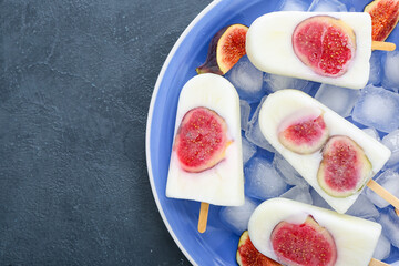 Plate with delicious fig ice-cream on dark background