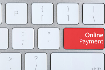 Modern keyboard with text Online Payment on red button, top view