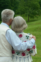 senior woman and man  in park. Back view