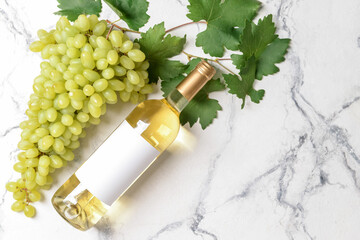 Bottle of tasty white wine on white background