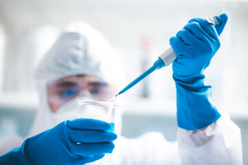 Fototapeta premium Health care researchers working in life science laboratory, medical science technology research work for test a vaccine, coronavirus covid-19 vaccine protection cure treatment