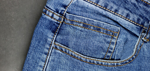 Fototapeta premium Blue jeans top on black background