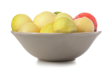 Bowl with sweet melon balls on white background