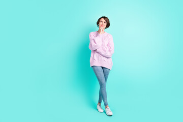 Fototapeta na wymiar Full length photo of sweet thoughtful woman wear violet sweater arm chin looking empty space isolated turquoise color background