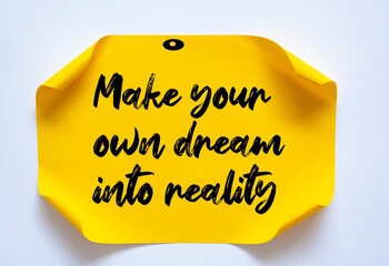 Text make your own dream into reality on the short note texture background