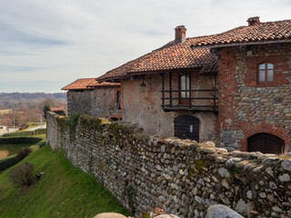 Fototapeta na wymiar houses surrounded by fortified walls of the medieval village .Ricetto di Candelo, Piedmont, Italy.
