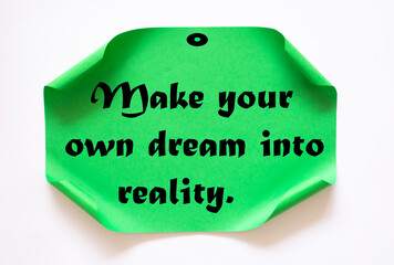 Text make your own dream into reality on the short note texture background