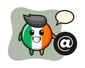 Cartoon illustration of ireland flag badge standing beside the At symbol