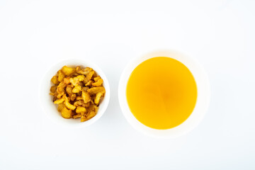 A bowl of golden chanterelles on white background