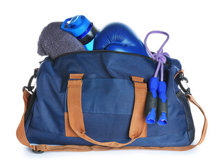 Bag with sports equipment on white background