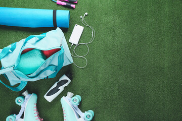 Composition with bag and sports equipment on color background