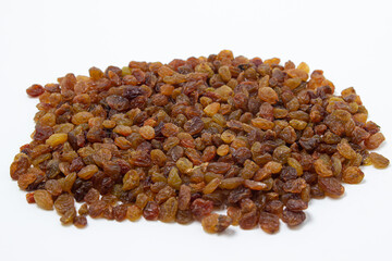 Isolated raisins on a white background. Healthy dried fruit. Dried grapes.