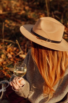 Young Woman With Wine On Picnic