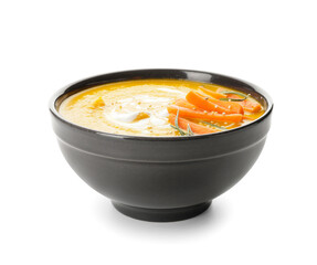 Bowl of tasty carrot cream soup on white background