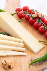 Close-up old cheddar on wooden background. Local name eski kaşar peynir