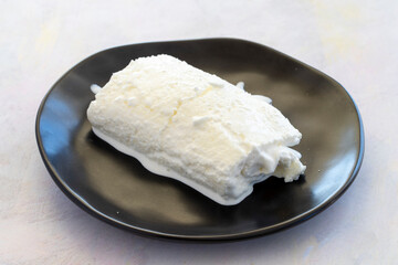 Close-up cow cream on wooden floor. Local name manda kaymağı