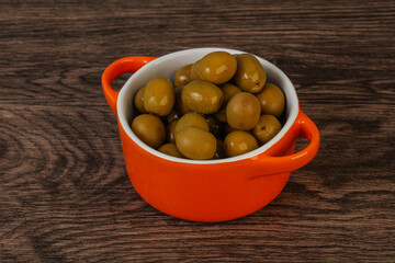 Green pickled olives in the bowl
