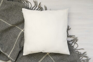 White blank pillow mockup, cozy winter composition with and warm wool blanket, square pillow case,...