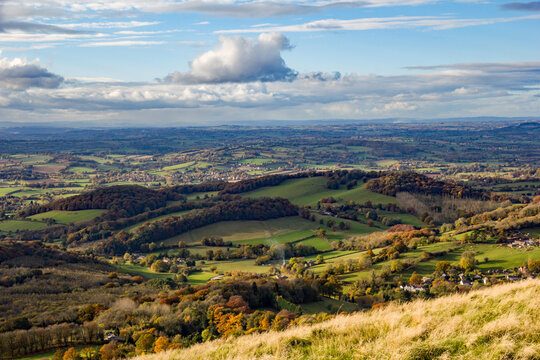Rolling hills and seasonal oranges and browns on this fall or autumnal image of English countryside in the Malvern Hills, Worcestershire