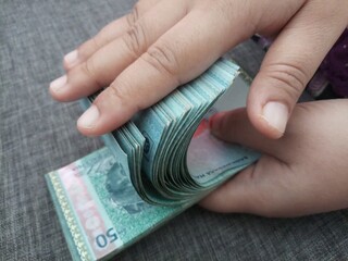 hand with money