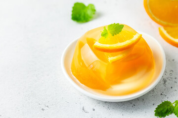 Light summer orange citrus jelly dessert. Space for text.